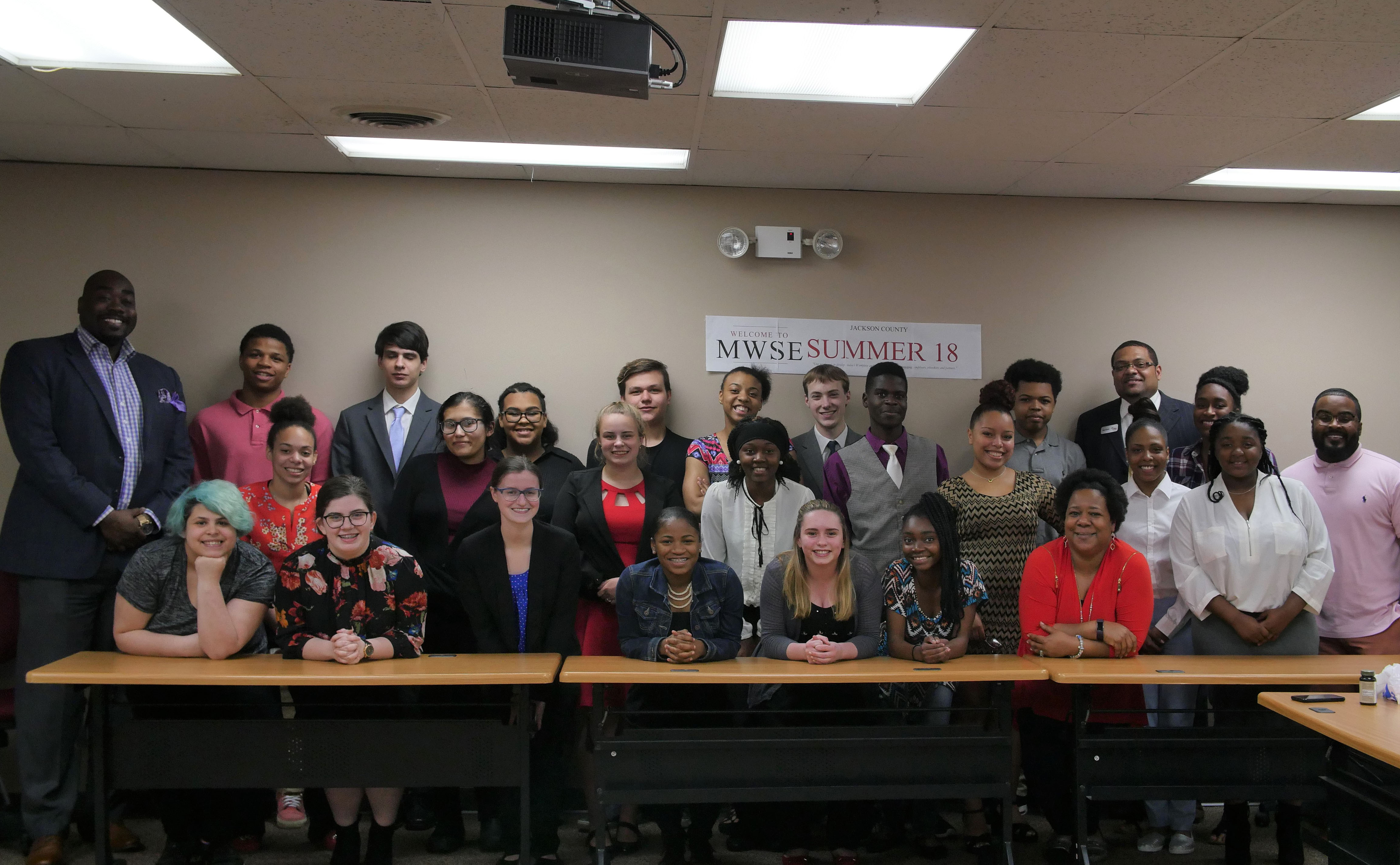 27 Youth and their advisors posing together