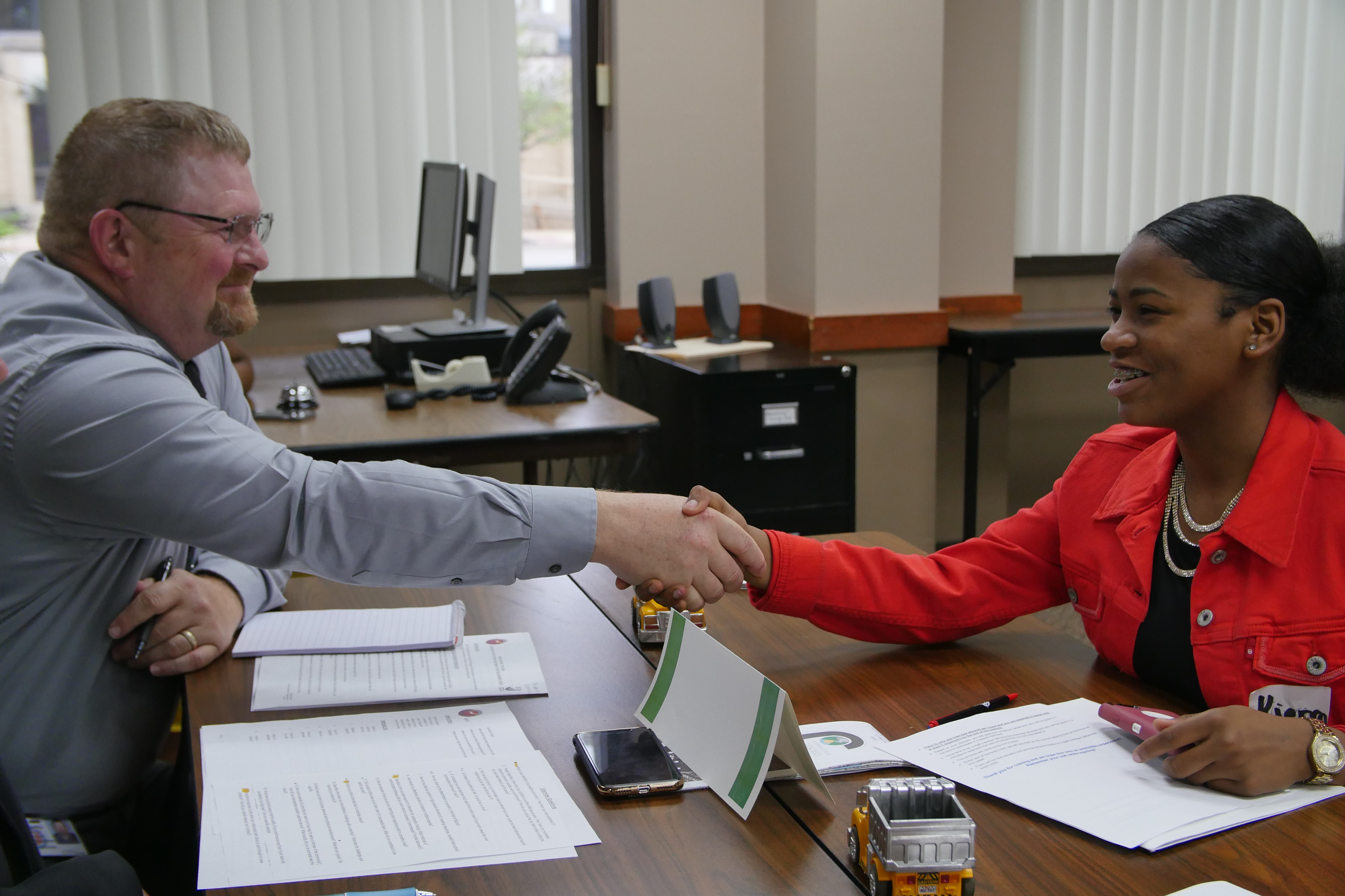 Youth and employer shake hands
