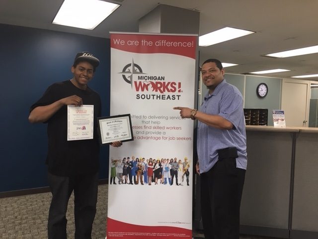 Steven (L) and Michael (R) posing for a picture at Michigan Works! with his GED!