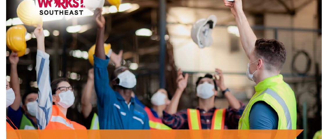 A diverse group of industrial workers raising their hemlets. Text reads: "Land Your Future Career!"